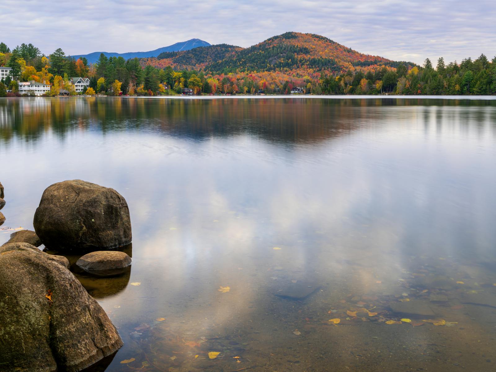 Mirror Lake with autumn trees and Adirondack mountains